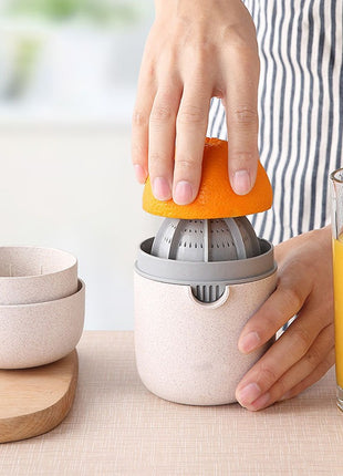 Manual Citrus Juicer with Measuring Cup, Lid, Strainer Ring and Dual Press Inserts