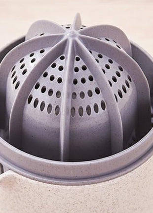 Manual Citrus Juicer with Measuring Cup, Lid, Strainer Ring and Dual Press Inserts