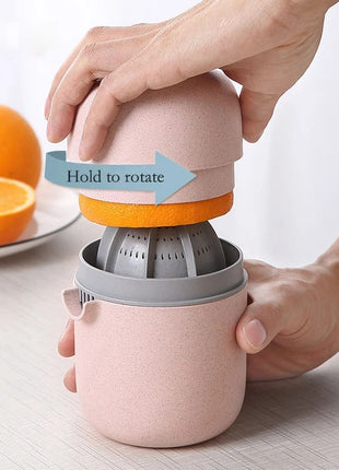 Manual Citrus Juicer with Measuring Cup, Lid, Strainer Ring and Dual Press Inserts